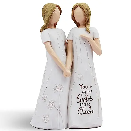 BORLESTA small, hand-painted resin statue of two friends embracing, with a pink and white color scheme.