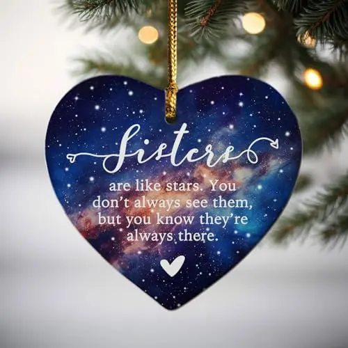 Round ceramic Christmas ornament with 'Sisters are like stars' design and a gift box