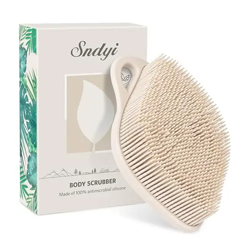 Sndyi oatmeal-colored silicone body scrubber in a unique leaf shape with dense bristles.