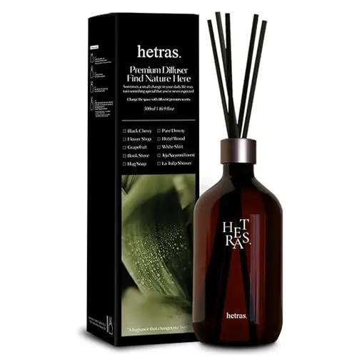 hetras. premium reed diffuser with hotel wood scent in a brown plastic bottle