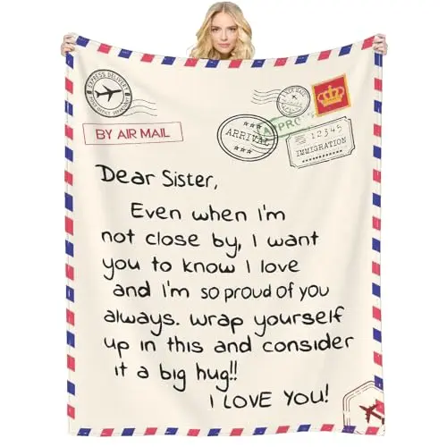 White throw blanket with a printed message for sister on a soft flannel fabric