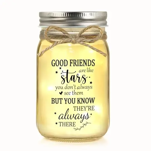 JOYCUFF clear glass mason jar with a bow-tied lid, filled with warm white LED string lights.